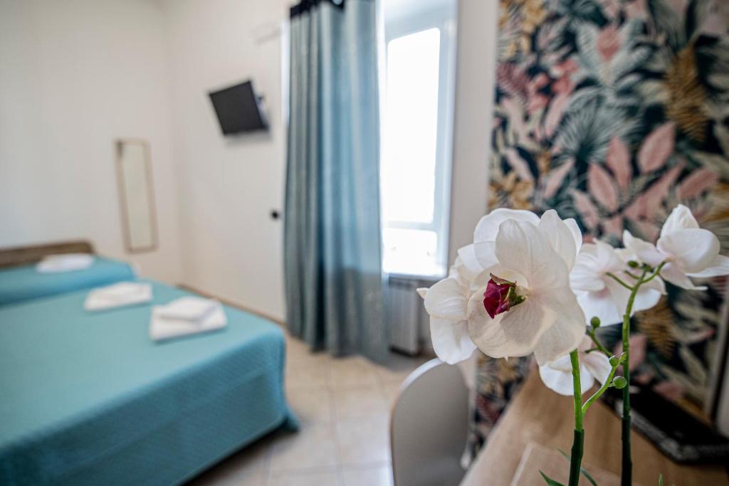 Postel nebo postele na pokoji v ubytování Hotel Dell'Urbe