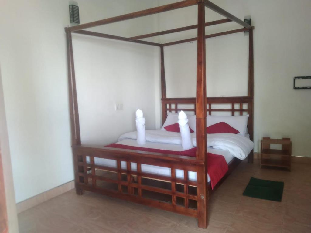 Postel nebo postele na pokoji v ubytování T-More Hotel & Hostel