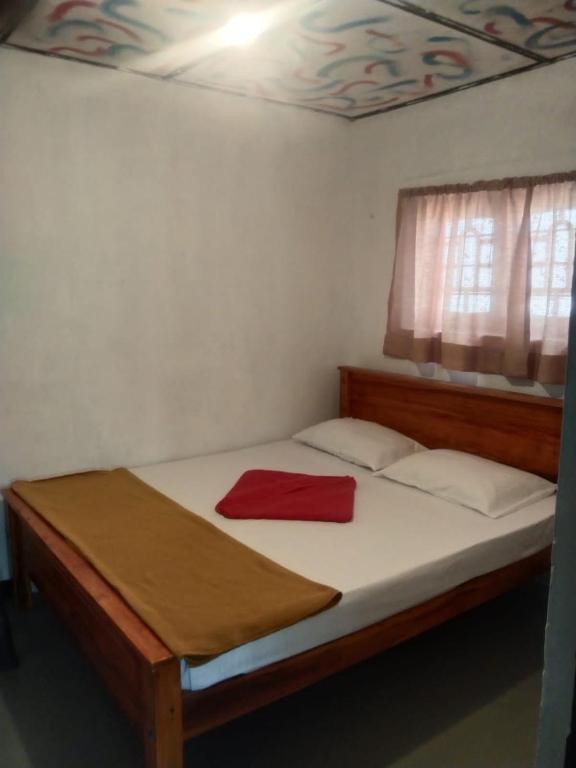 Postel nebo postele na pokoji v ubytování T-More Hotel & Hostel
