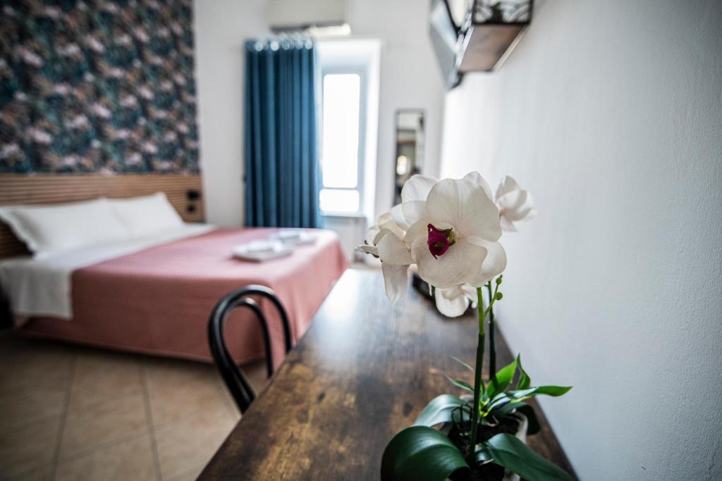 Postel nebo postele na pokoji v ubytování Hotel Dell'Urbe