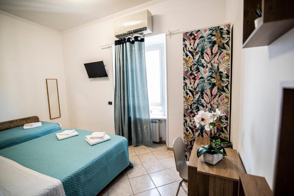 Postel nebo postele na pokoji v ubytování Hotel Dell'Urbe