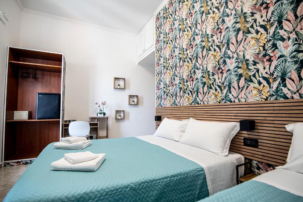Postel nebo postele na pokoji v ubytování Hotel Dell'Urbe