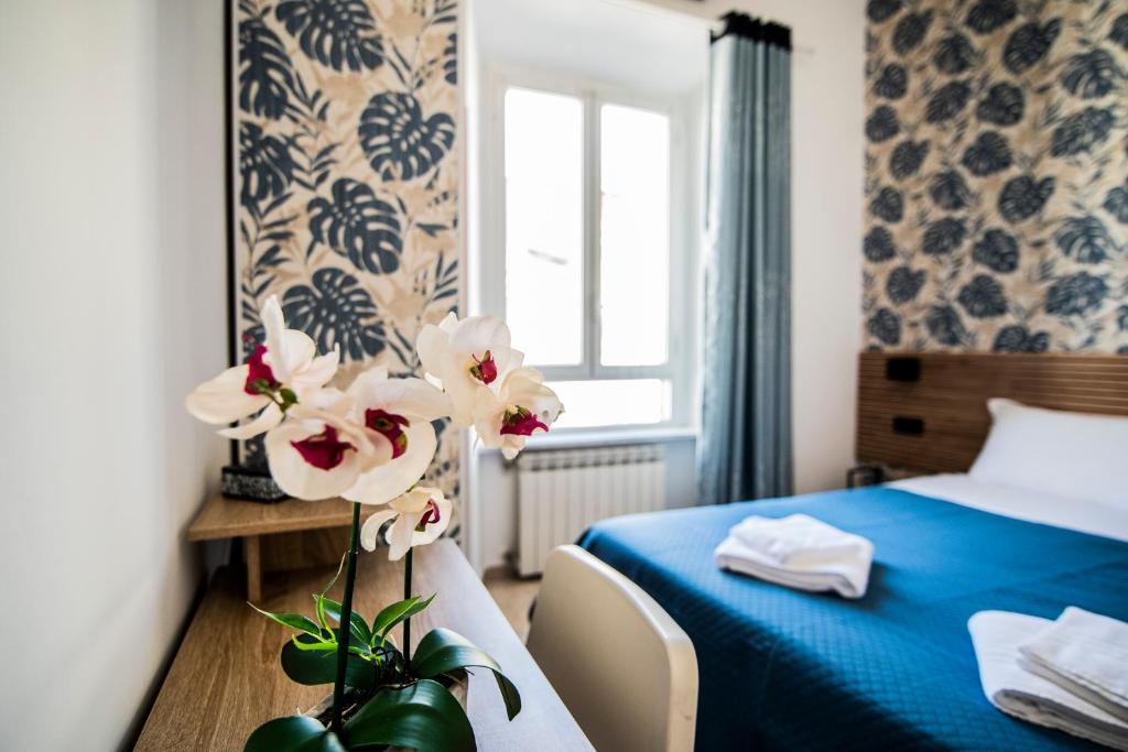 Postel nebo postele na pokoji v ubytování Hotel Dell'Urbe