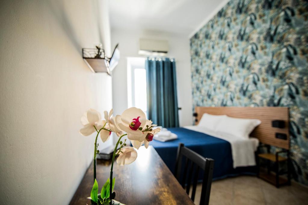 Postel nebo postele na pokoji v ubytování Hotel Dell'Urbe