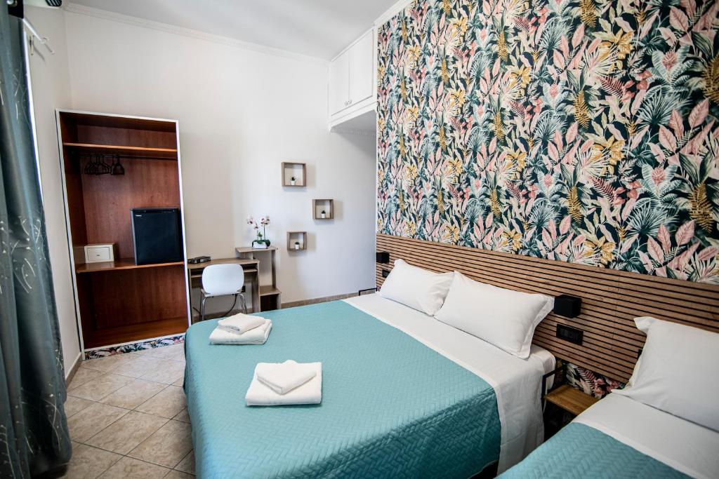 Postel nebo postele na pokoji v ubytování Hotel Dell'Urbe