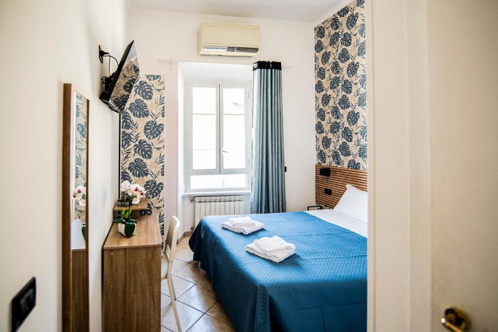 Postel nebo postele na pokoji v ubytování Hotel Dell'Urbe