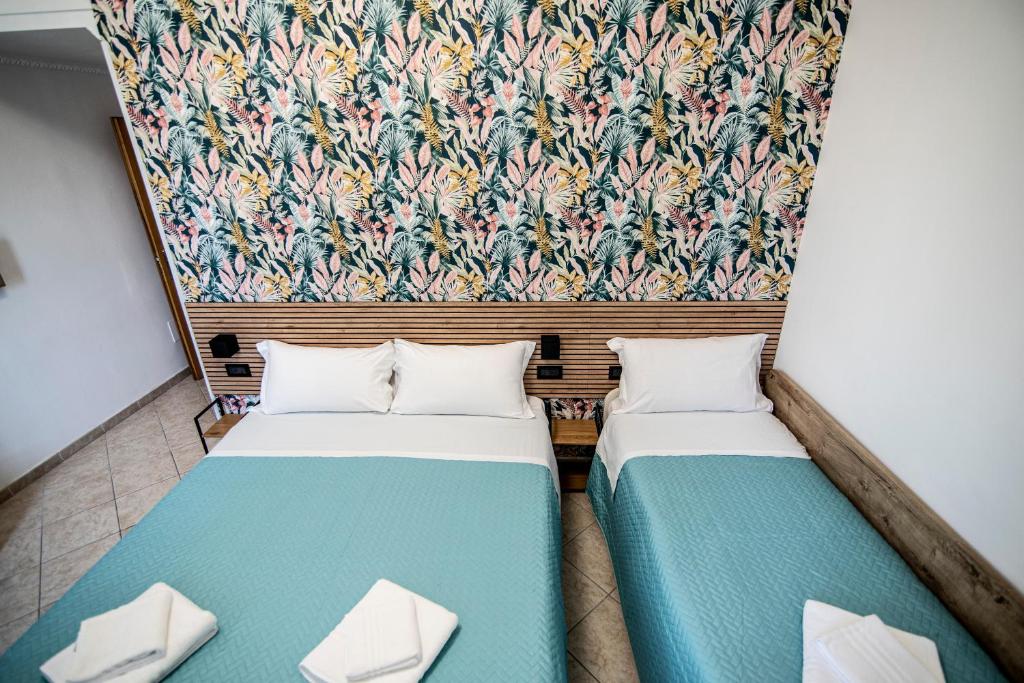 Postel nebo postele na pokoji v ubytování Hotel Dell'Urbe