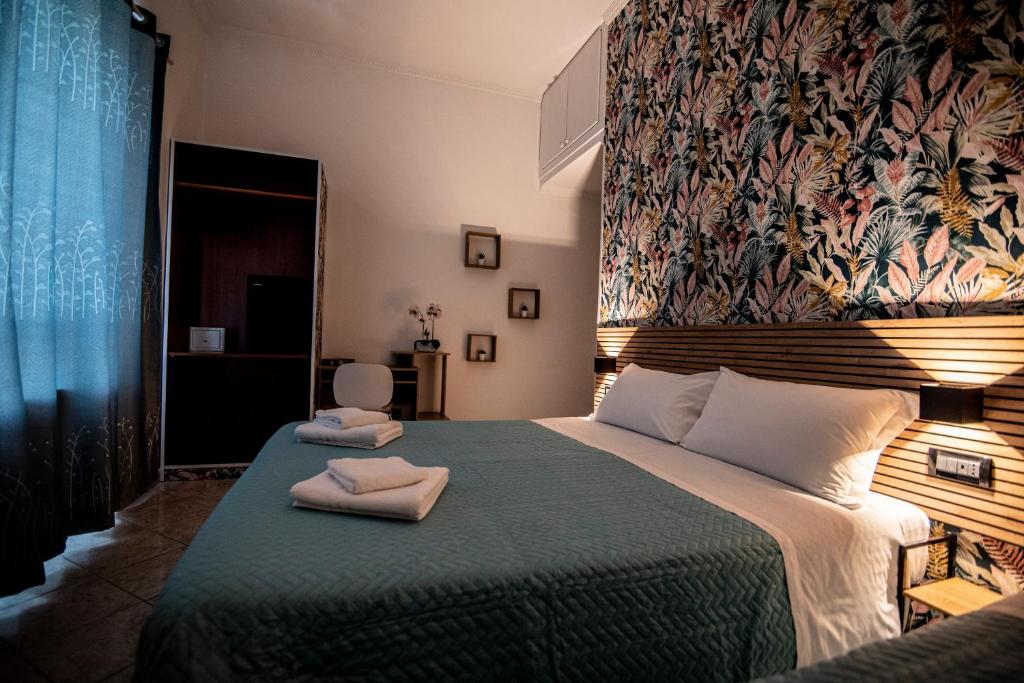 Postel nebo postele na pokoji v ubytování Hotel Dell'Urbe