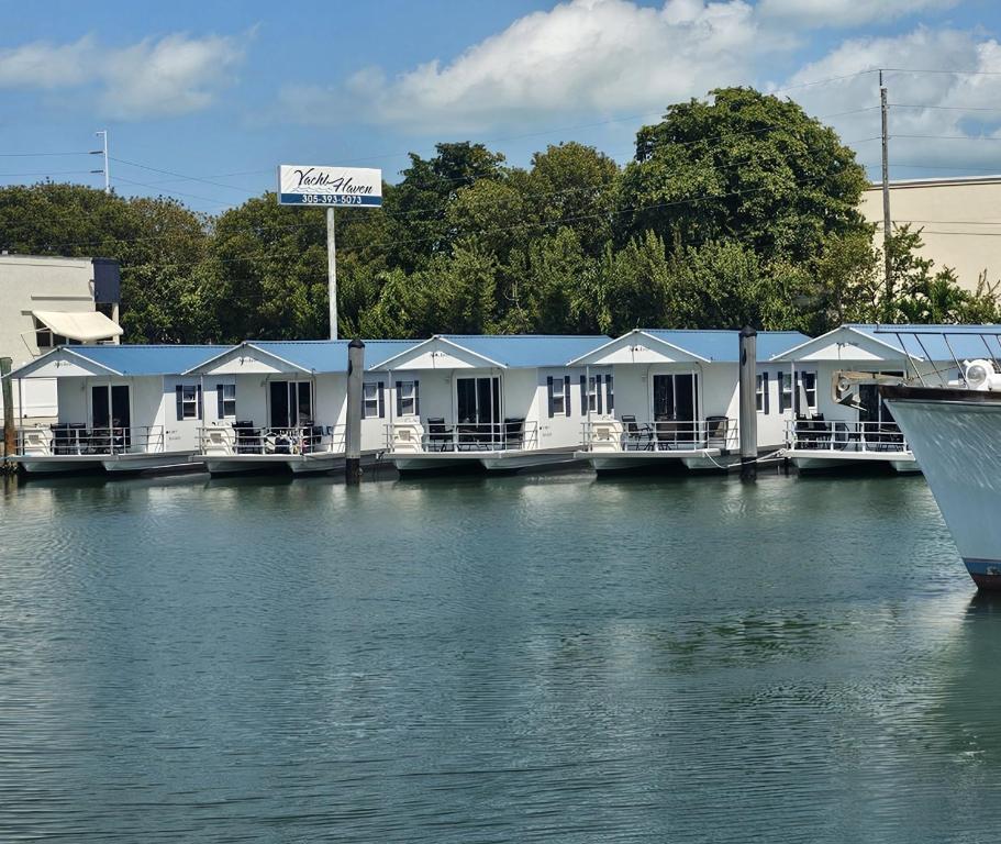 a row of white houses on the water at Yacht Haven in Marathon