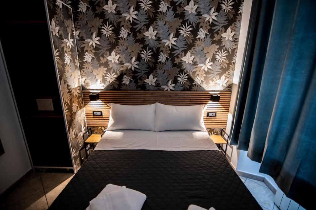 Postel nebo postele na pokoji v ubytování Hotel Dell'Urbe