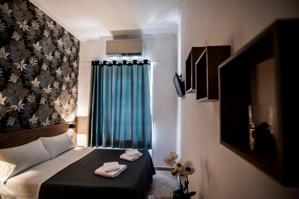 Postel nebo postele na pokoji v ubytování Hotel Dell'Urbe