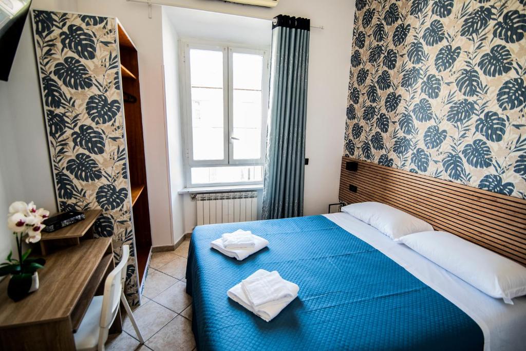 Postel nebo postele na pokoji v ubytování Hotel Dell'Urbe