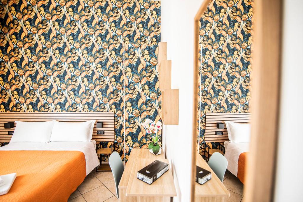 Postel nebo postele na pokoji v ubytování Hotel Dell'Urbe