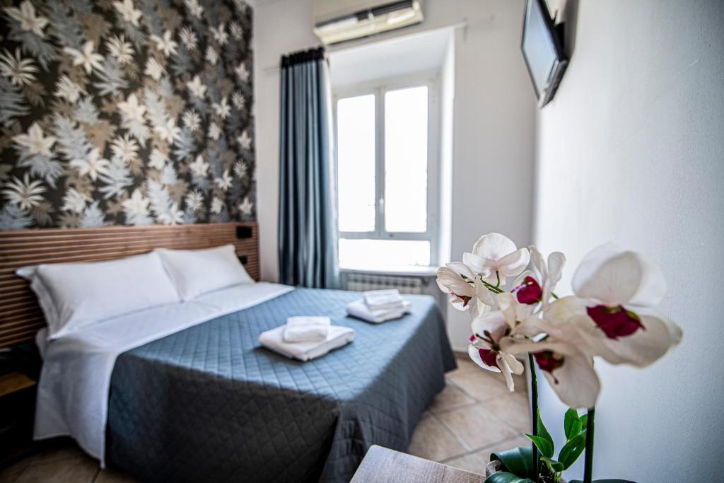 Postel nebo postele na pokoji v ubytování Hotel Dell'Urbe