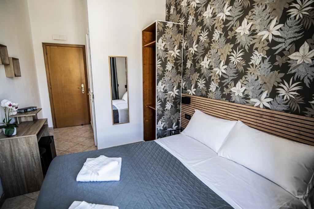 Postel nebo postele na pokoji v ubytování Hotel Dell'Urbe