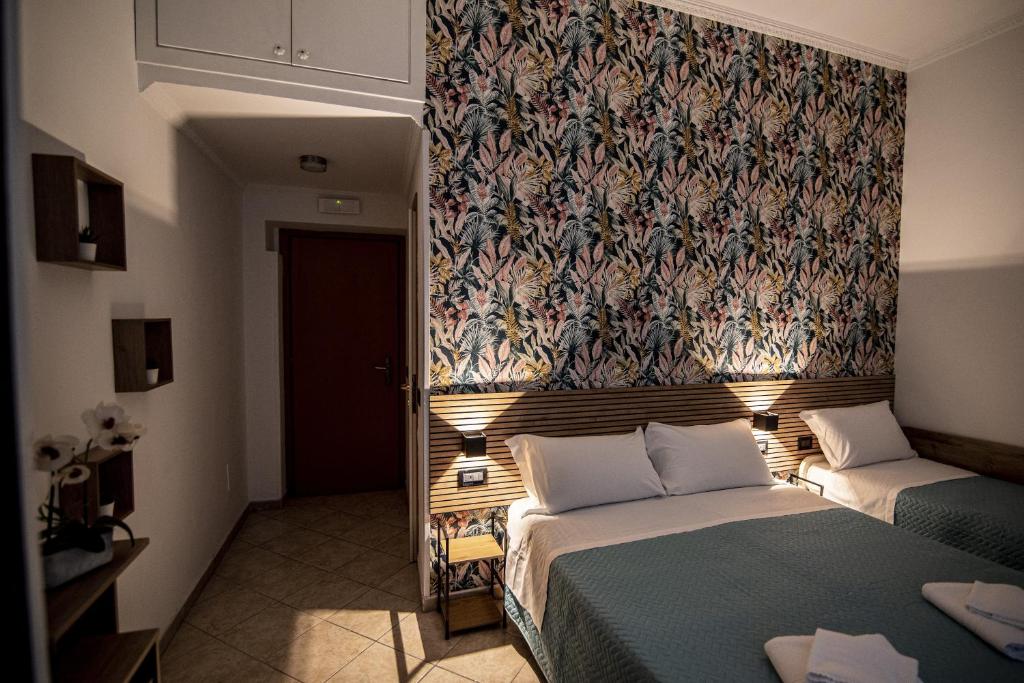 Postel nebo postele na pokoji v ubytování Hotel Dell'Urbe