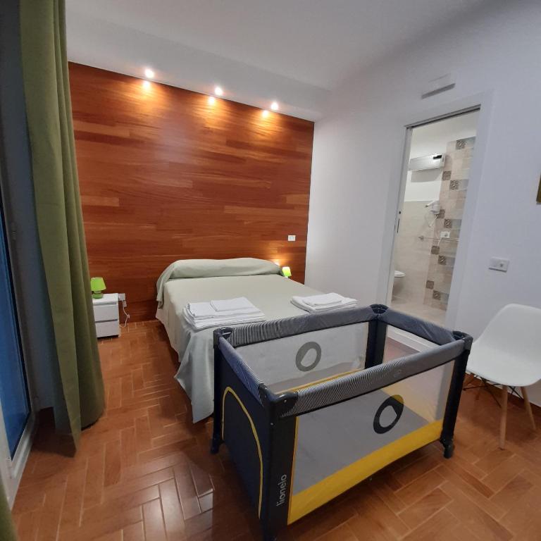 Postel nebo postele na pokoji v ubytování L'Attico di Matilde