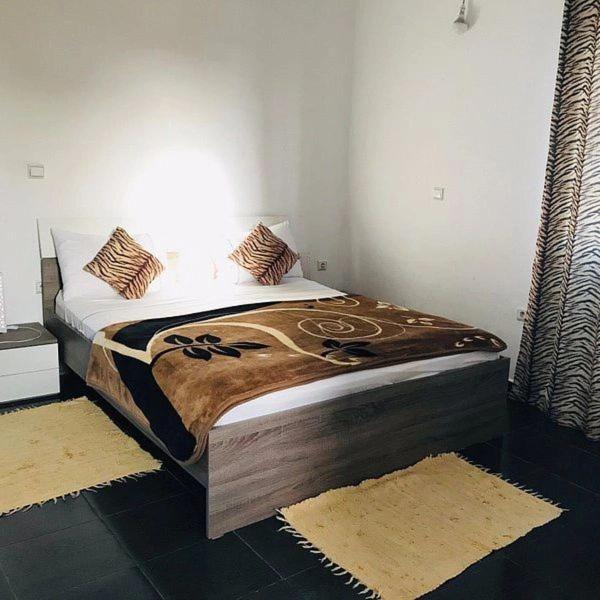 a bedroom with a bed in a room at sidi kaouki ayt karoum in Sidi Kaouki