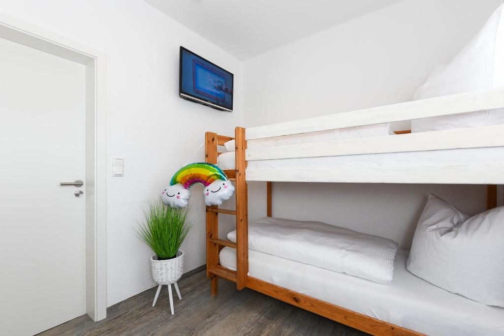 Postel nebo postele na pokoji v ubytování Haus Strandkorb mit Frühstücksoption