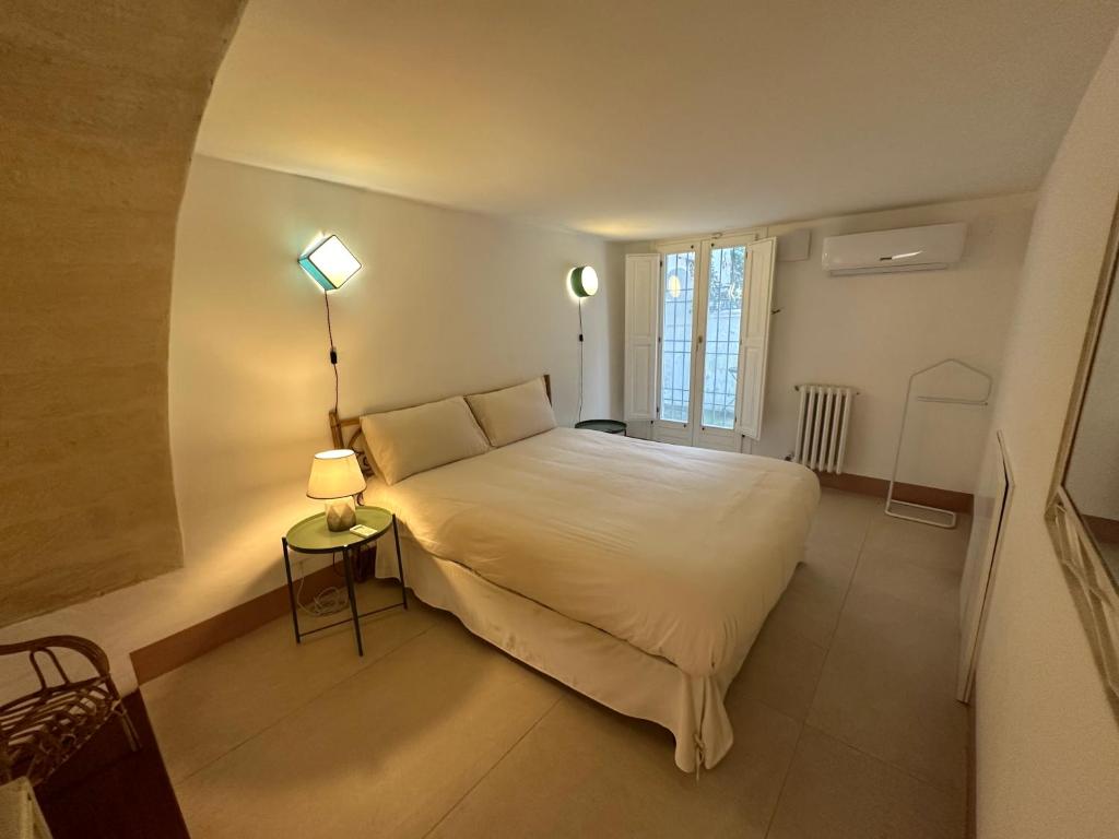 4 Balconi rooms Paladini B&B e appartamenti tesisinde bir odada yatak veya yataklar