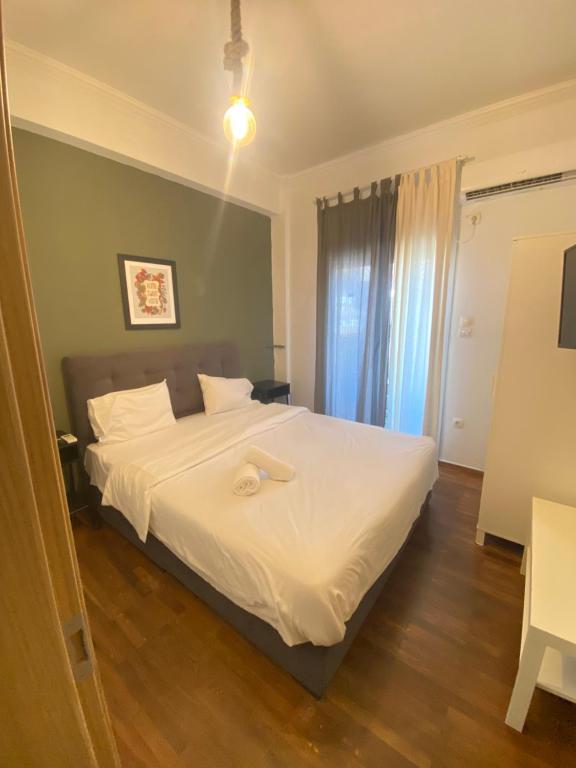 Łóżko lub łóżka w pokoju w obiekcie Athens City Themis 7