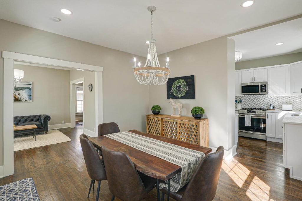 a dining room and kitchen with a table and chairs at Riverfront Newton Vacation Rental Near Wichita! in Newton
