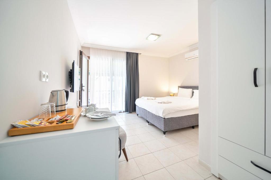 Postel nebo postele na pokoji v ubytování Dedeminn Garden Hotel