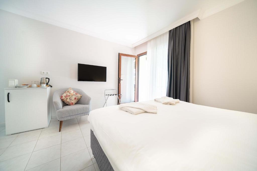 Postel nebo postele na pokoji v ubytování Dedeminn Garden Hotel