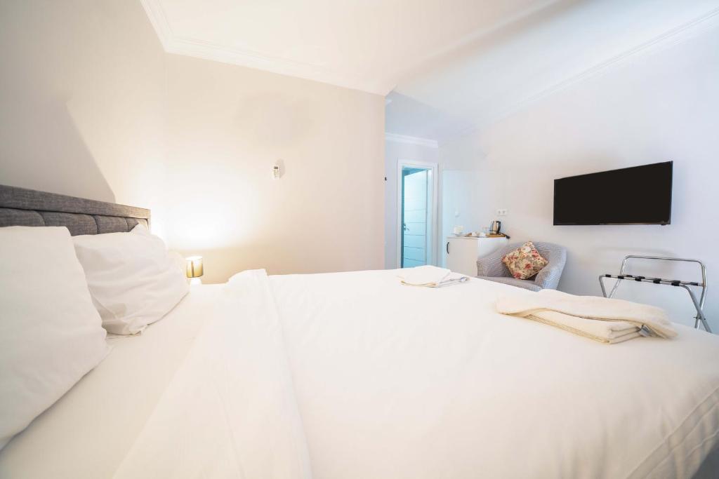Postel nebo postele na pokoji v ubytování Dedeminn Garden Hotel