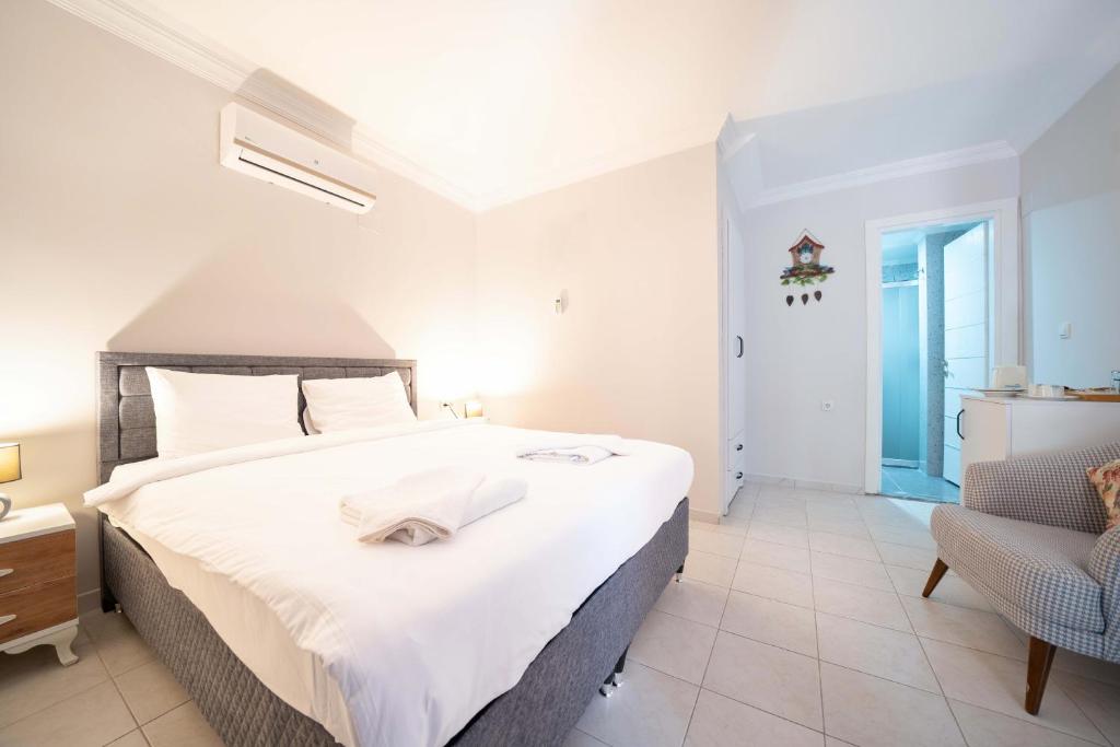 Postel nebo postele na pokoji v ubytování Dedeminn Garden Hotel