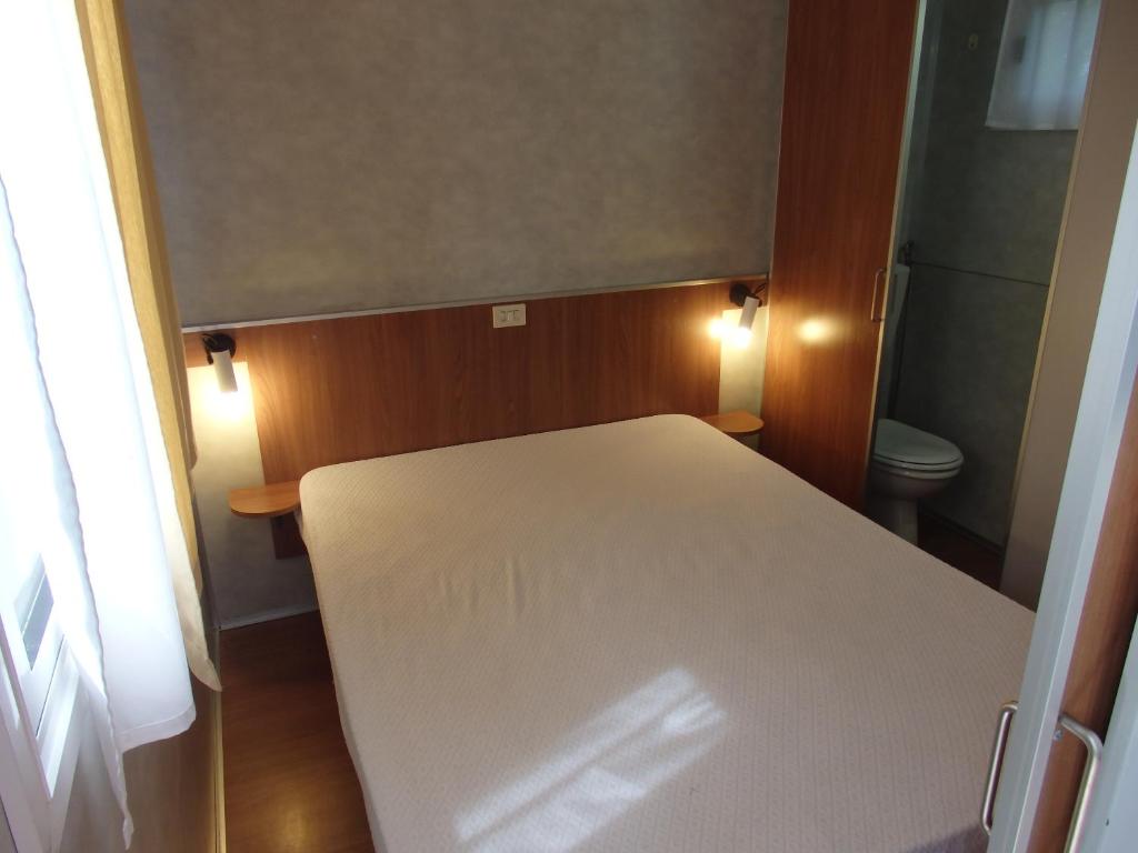 Postel nebo postele na pokoji v ubytování Camping Village la Chiocciola