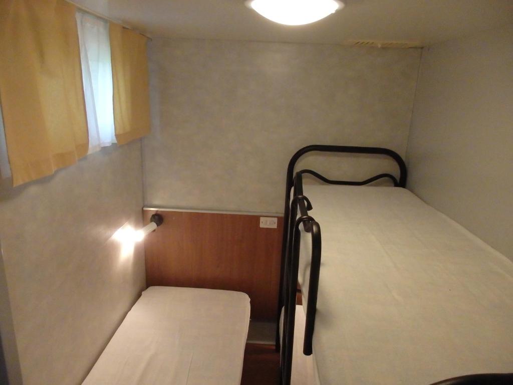 Postel nebo postele na pokoji v ubytování Camping Village la Chiocciola