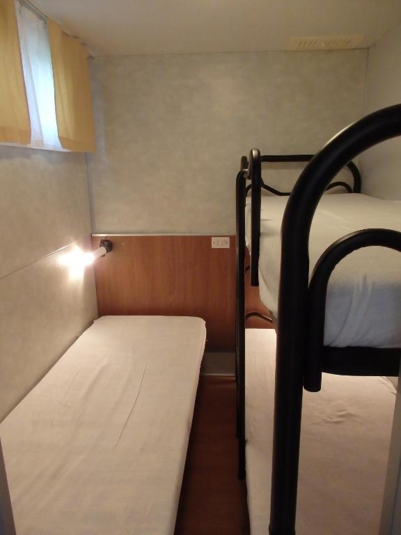 Postel nebo postele na pokoji v ubytování Camping Village la Chiocciola
