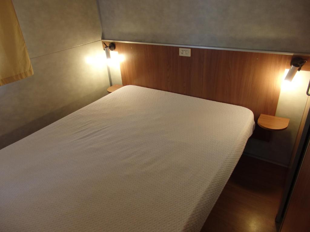 Postel nebo postele na pokoji v ubytování Camping Village la Chiocciola