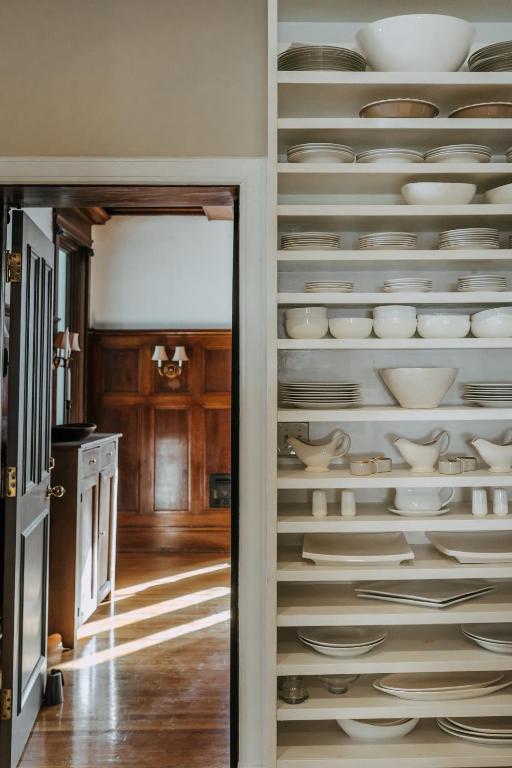 a room with plates and bowls on the wall at No. 5 East in Winnipeg