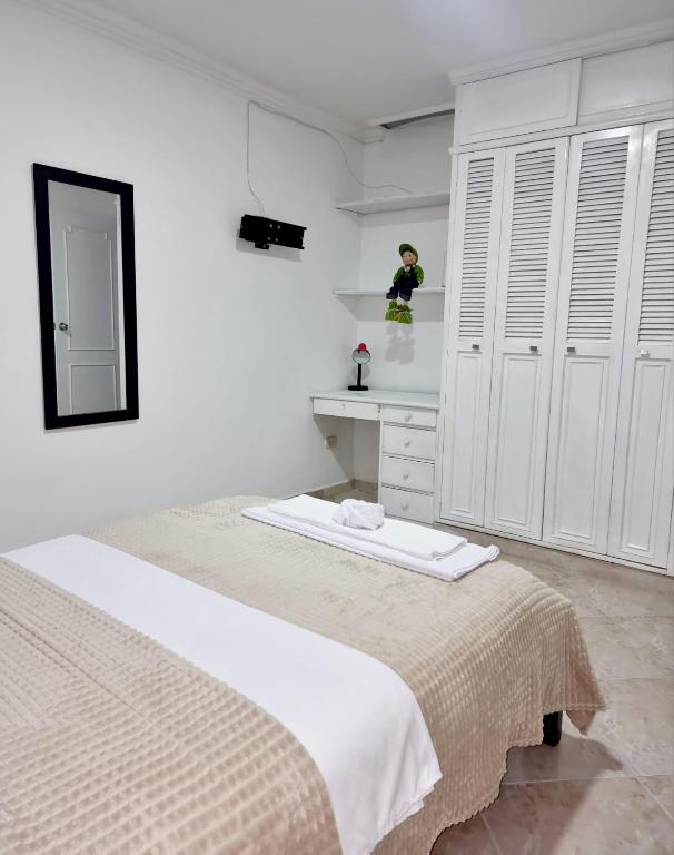 Postel nebo postele na pokoji v ubytování Hermosa casa en Bucaramanga