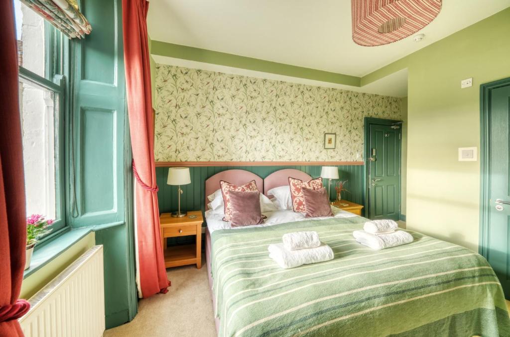 Postel nebo postele na pokoji v ubytování Hill House
