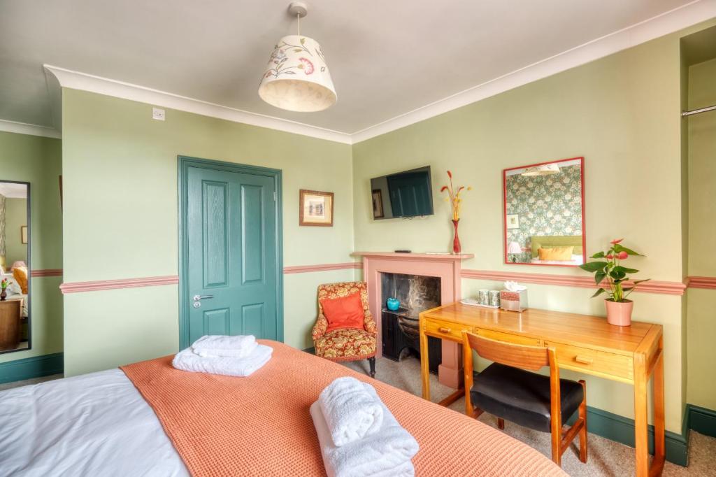 Postel nebo postele na pokoji v ubytování Hill House