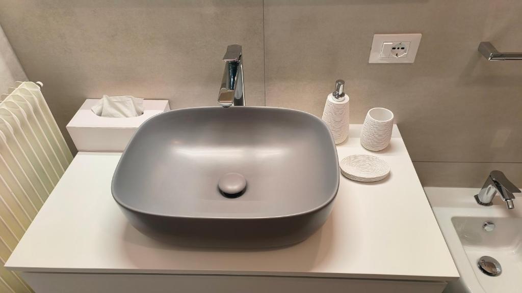a bathroom with a bowl shaped sink on a counter at Sottocastello 1 in Gorizia
