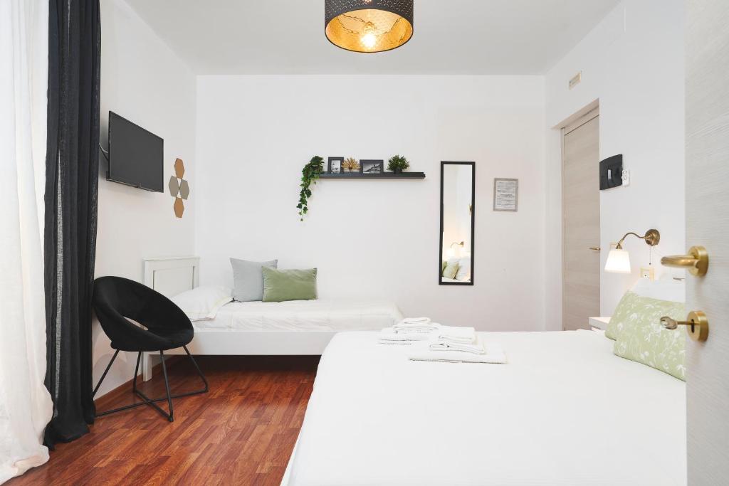 Letto o letti in una camera di Quiet Night Affittacamere La Spezia