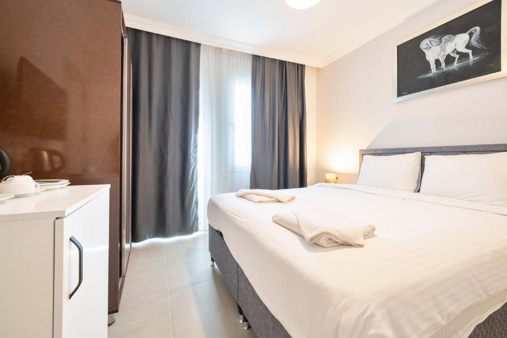 Postel nebo postele na pokoji v ubytování Dedeminn Garden Hotel