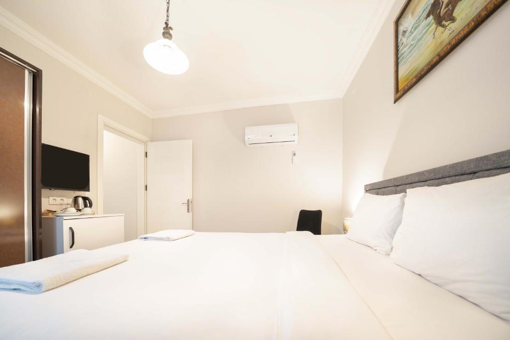 Postel nebo postele na pokoji v ubytování Dedeminn Garden Hotel