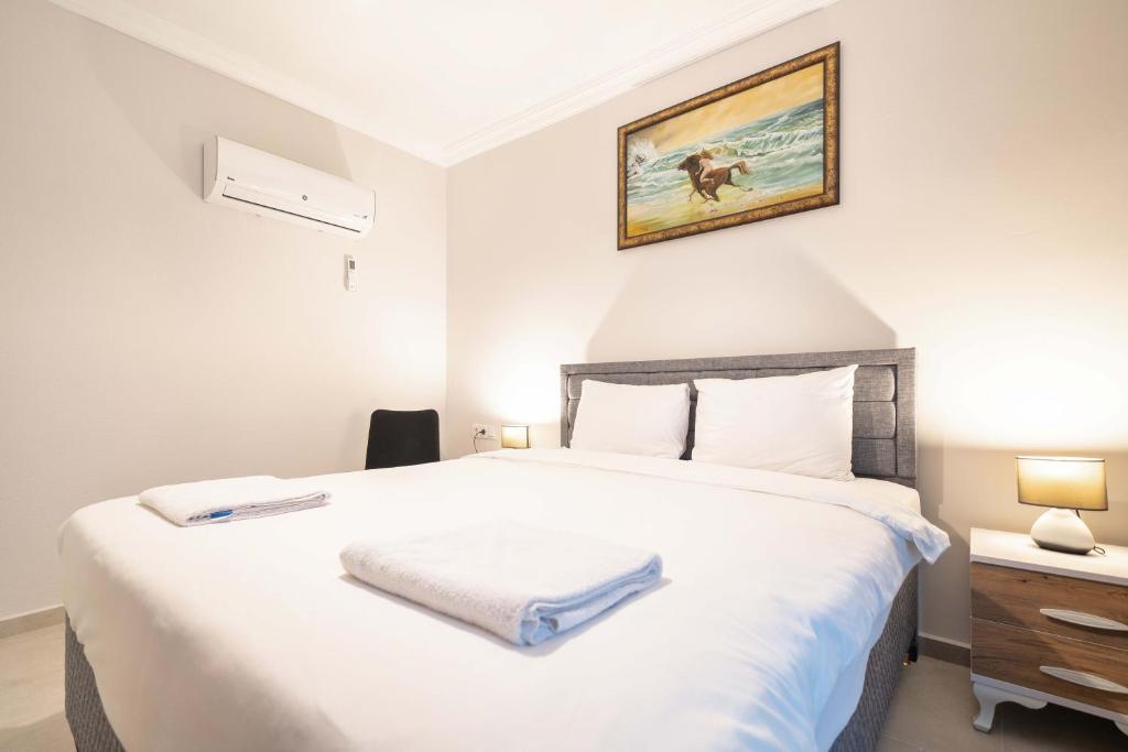 Postel nebo postele na pokoji v ubytování Dedeminn Garden Hotel
