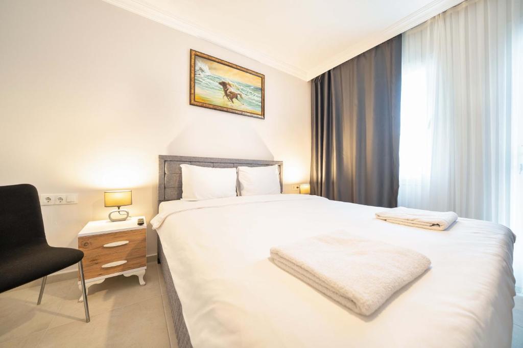 Postel nebo postele na pokoji v ubytování Dedeminn Garden Hotel