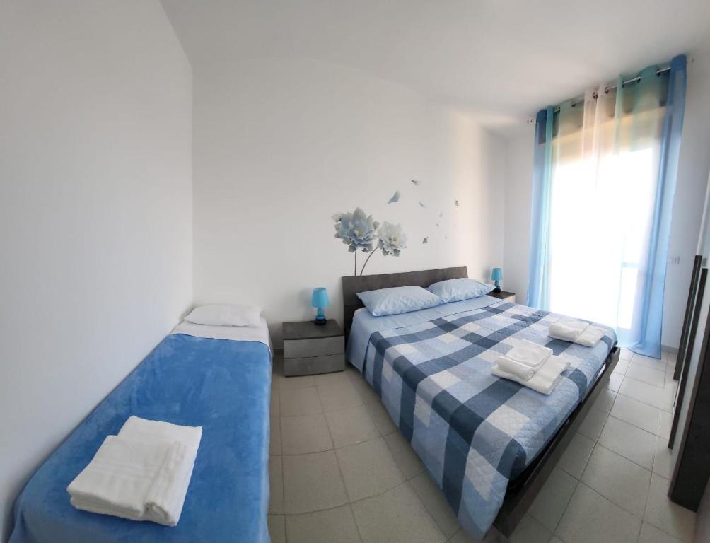 Postel nebo postele na pokoji v ubytování da Ale Casa vacanze - holiday house