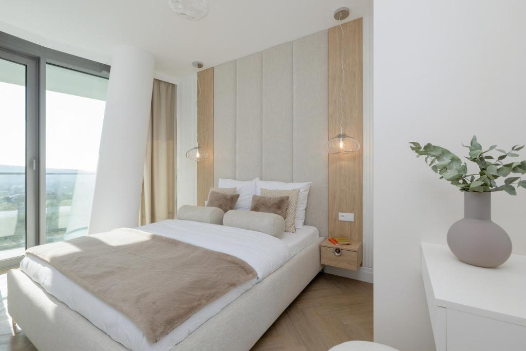 En eller flere senge i et værelse på Wave Międzyzdroje Luxury Apartment MORENORENT
