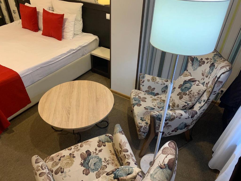 Postel nebo postele na pokoji v ubytování East Gate Boutique Hotel