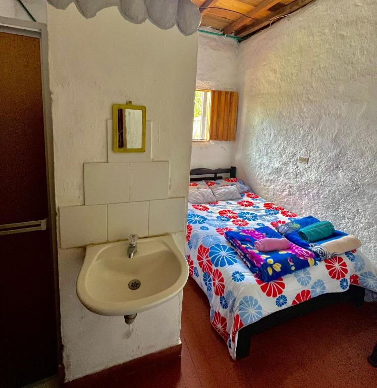 Postel nebo postele na pokoji v ubytování Casa Annunakis