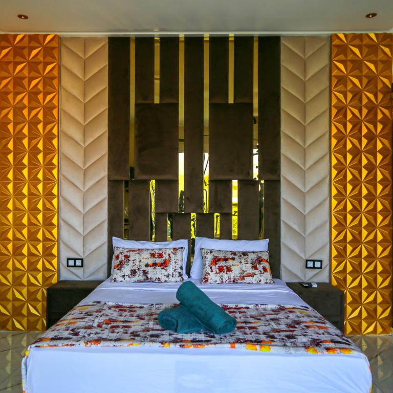 Postel nebo postele na pokoji v ubytování Hotel Jnane riad