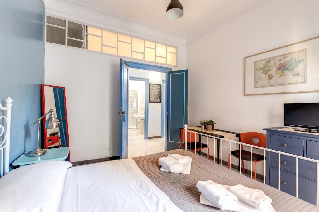 Uma cama ou camas num quarto em Locanderia Roma
